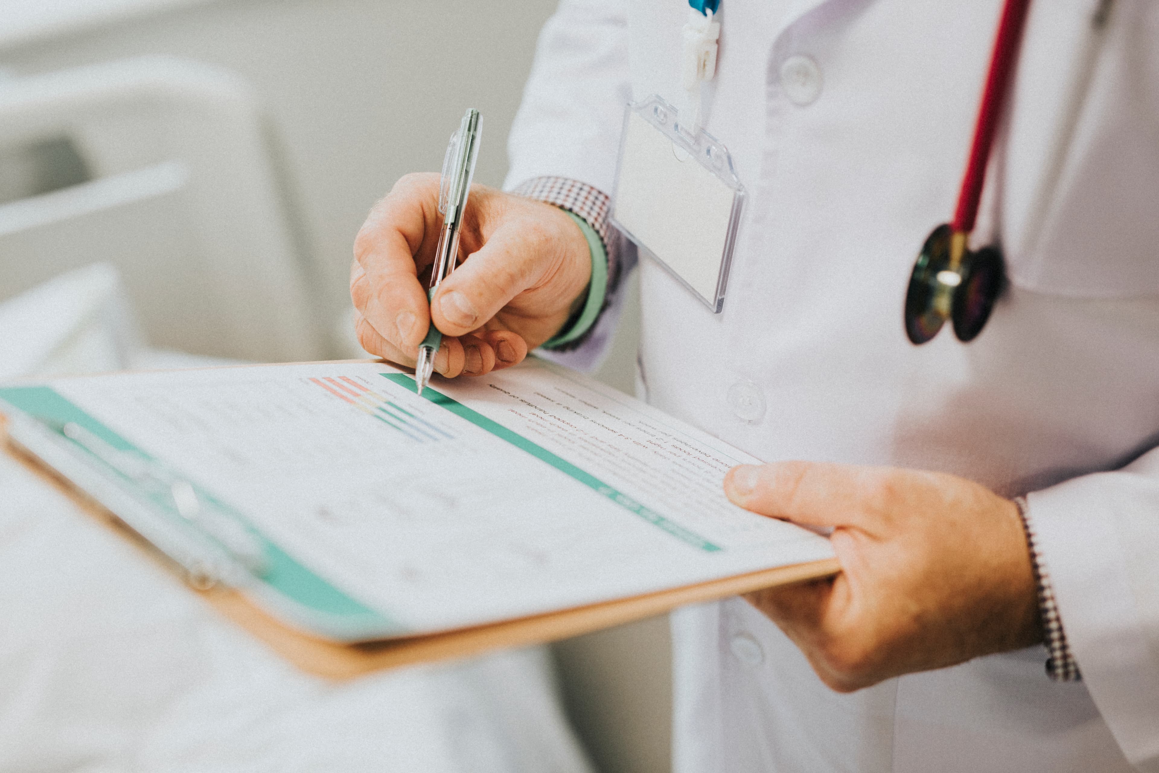 Doctor assessing patient during rehabilitation consultation